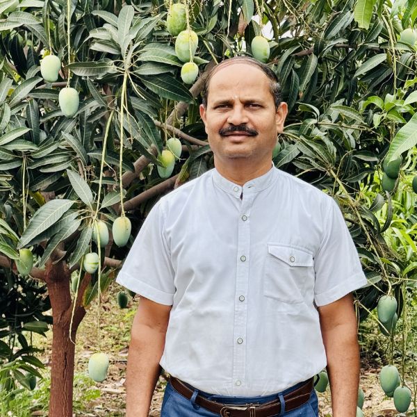 Dr. Sharad Gadekar in the orchard